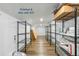 Finished and climate controlled attic space with wood floors and shelving at 2187 Annie Laura Ln, Mount Pleasant, SC 29466