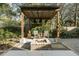 Backyard featuring a pergola, firepit, patio, and lush landscaping at 2187 Annie Laura Ln, Mount Pleasant, SC 29466