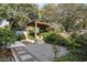 Secluded backyard boasts a fire pit, pergola, patio and mature landscaping at 2187 Annie Laura Ln, Mount Pleasant, SC 29466