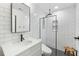 A bright bathroom featuring a vanity and a shower with black hardware at 2187 Annie Laura Ln, Mount Pleasant, SC 29466