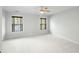 A serene bedroom with neutral walls, plush carpeting, and windows with views at 2187 Annie Laura Ln, Mount Pleasant, SC 29466