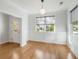 Bright dining room with beautiful hardwood floors, modern light fixture, and wainscoting at 2187 Annie Laura Ln, Mount Pleasant, SC 29466