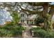 Charming two-story home with inviting brick pathway, lush landscaping, and mature tree at 2187 Annie Laura Ln, Mount Pleasant, SC 29466