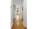 Upstairs hallway with hardwood floors, modern fixtures, and natural light at 2187 Annie Laura Ln, Mount Pleasant, SC 29466
