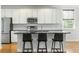 Modern kitchen featuring stainless steel appliances, granite countertops, and a breakfast bar at 2187 Annie Laura Ln, Mount Pleasant, SC 29466