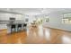 Bright open-concept kitchen with stainless appliances, white cabinets, granite countertops, and island with barstool seating at 2187 Annie Laura Ln, Mount Pleasant, SC 29466