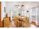 Bright dining room featuring a wooden table set, hardwood floors, and natural light streaming through large windows at 220 New Oak Ln, Moncks Corner, SC 29461