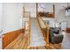 Grand foyer features soaring ceilings, wood floors, and a staircase leading to a loft at 220 New Oak Ln, Moncks Corner, SC 29461