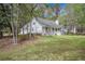 Lovely one-story house featuring a spacious lawn and classic white siding at 220 New Oak Ln, Moncks Corner, SC 29461