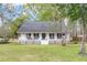 Inviting single-level home with a quaint front porch and well-kept yard at 220 New Oak Ln, Moncks Corner, SC 29461