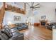 Spacious living room with vaulted ceilings, a fireplace, and comfortable leather seating at 220 New Oak Ln, Moncks Corner, SC 29461