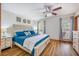 Inviting primary bedroom featuring a queen-sized bed with blue bedding and windows with natural light at 220 New Oak Ln, Moncks Corner, SC 29461