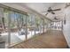 Relaxing screened porch includes two ceiling fans and views of the backyard at 220 New Oak Ln, Moncks Corner, SC 29461