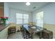 Bright dining area with large table, natural light, and view into the kitchen at 226 Killarney Trl, Moncks Corner, SC 29461