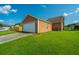 Exterior view of a home's spacious two-car garage with attached house on a bright, sunny day at 226 Killarney Trl, Moncks Corner, SC 29461