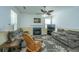 Inviting living room featuring a fireplace, plush sofas, and a ceiling fan at 226 Killarney Trl, Moncks Corner, SC 29461