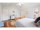 Bright bedroom with vaulted ceiling, hardwood floors, ceiling fan, and a view of the closet doors at 234 Lipman St, Summerville, SC 29483