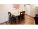 Dining area with a modern table, four chairs, and view to the living room at 234 Lipman St, Summerville, SC 29483