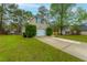 Charming home featuring a garage, well-manicured lawn, and a concrete driveway at 234 Lipman St, Summerville, SC 29483