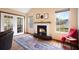 Cozy living room with fireplace, wood floors, and access to outdoor patio at 234 Lipman St, Summerville, SC 29483