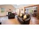 Bright living room with fireplace, wood floors, and open layout to kitchen at 234 Lipman St, Summerville, SC 29483