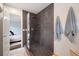 Sleek tile shower with frameless glass door and peek into adjacent main bedroom at 234 Lipman St, Summerville, SC 29483