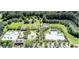 Overhead view of community amenities including pools, playground, green spaces, and walking paths, adjacent to a river at 2681 Park West Blvd, Mount Pleasant, SC 29466