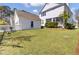 Large grassy backyard with a detached garage and plenty of space for outdoor activities at 2681 Park West Blvd, Mount Pleasant, SC 29466