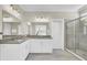 Bathroom with a double vanity, large mirror, and glass-enclosed shower at 2681 Park West Blvd, Mount Pleasant, SC 29466