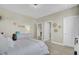 Bright bedroom with neutral walls, carpeted floors, dresser and decorative flower wall hangings at 2681 Park West Blvd, Mount Pleasant, SC 29466
