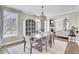 Bright dining room with a modern chandelier and view to the living room at 2681 Park West Blvd, Mount Pleasant, SC 29466