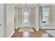 Inviting foyer with hardwood floors, neutral paint, and natural light from the front door at 2681 Park West Blvd, Mount Pleasant, SC 29466