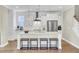 Contemporary kitchen with stainless appliances, a stylish island with seating, and ample cabinet space at 2681 Park West Blvd, Mount Pleasant, SC 29466