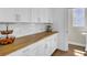 Kitchen with white cabinets, butcher block countertops, and stainless steel hardware at 2681 Park West Blvd, Mount Pleasant, SC 29466