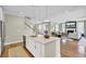 Open concept kitchen island with white cabinets and a view of the living room at 2681 Park West Blvd, Mount Pleasant, SC 29466