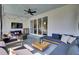 Cozy screened porch featuring modern furniture, a ceiling fan, and seamless access to the indoors through sliding glass doors at 2681 Park West Blvd, Mount Pleasant, SC 29466