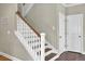 Staircase with stained treads, white risers, and a wooden handrail at 2681 Park West Blvd, Mount Pleasant, SC 29466