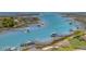 Expansive aerial view showcases the waterfront property, including docks, boats, and surrounding waterways at 27 Waterway Island Dr, Isle of Palms, SC 29451