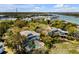 Stunning aerial shot of a home with a pool, surrounded by lush greenery near the waterway at 27 Waterway Island Dr, Isle of Palms, SC 29451