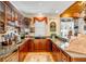 Custom bar area with wood cabinetry, granite countertops, and plenty of storage space at 27 Waterway Island Dr, Isle of Palms, SC 29451
