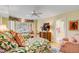 Inviting bedroom featuring two beds, a window seat, and access to a bathroom at 27 Waterway Island Dr, Isle of Palms, SC 29451