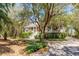 Charming home featuring a welcoming porch, mature landscaping, and a grand entrance staircase at 27 Waterway Island Dr, Isle of Palms, SC 29451