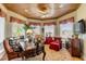 Inviting home office featuring wood paneled ceilings, natural light and a comfortable seating area at 27 Waterway Island Dr, Isle of Palms, SC 29451