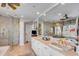 Luxurious main bathroom with dual sinks, soaking tub, and walk-in shower offers spa-like experience at 27 Waterway Island Dr, Isle of Palms, SC 29451