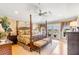 Serene main bedroom features a four poster bed, balcony access, and natural light at 27 Waterway Island Dr, Isle of Palms, SC 29451