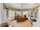 Dedicated home office with built-in shelving and natural light offers productive workspace at 27 Waterway Island Dr, Isle of Palms, SC 29451