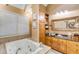 This primary bathroom features a soaking tub and a vanity with granite countertops at 28 Rebellion Rd, Charleston, SC 29407