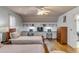 This bedroom has two beds, built-in desks, hardwood floors, and a ceiling fan at 28 Rebellion Rd, Charleston, SC 29407