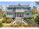 Stately two-story home featuring an inviting entrance and beautiful landscaping at 28 Rebellion Rd, Charleston, SC 29407