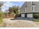 Exterior of home showing a two-car garage and a driveway with ample parking space at 28 Rebellion Rd, Charleston, SC 29407